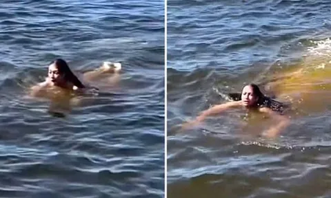 "Thủy quái" lặng lẽ bơi ngay sát người phụ nữ đang tắm sông, chỉ vài chục giây khiến mạng xã hội xôn xao